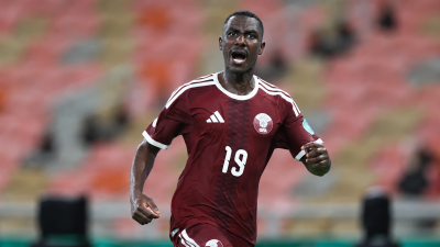 Qatar-footballer-framed-by-stadium-lights.png